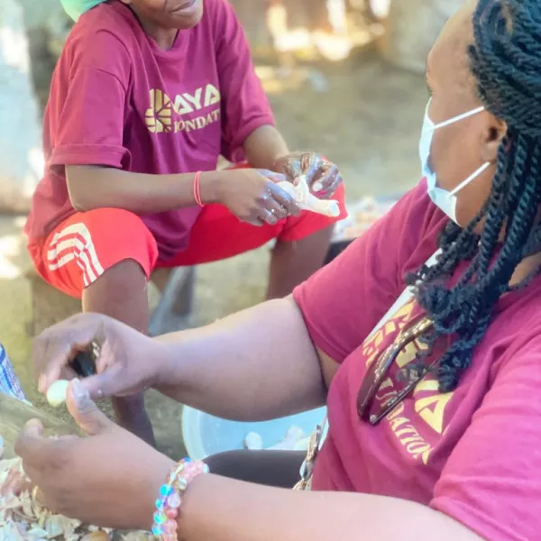 Two women sitting down and working